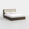 A modern bed with a dark wooden frame, beige upholstered headboard, and white bedding including two pillows, set against a plain white background.