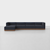 A modern, dark gray sectional sofa with a wooden base is set against a plain white background. The sofa has an L-shape design with clean lines and low-profile cushions.