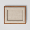 A rectangular, beige upholstered cushion is framed by a light wooden border, photographed from above against a plain white background.