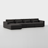 A modern dark gray sectional sofa with a left-facing chaise lounge, featuring five seat cushions and five back cushions, set against a plain white background.