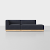 A modern sectional sofa with dark navy upholstery and a light wooden base, featuring a left armrest and an extended chaise on the right, set against a plain light background.