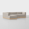 A modern, light gray L-shaped sectional sofa with clean lines and a light wood base, set against a plain white background.