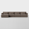 A large, modern brown sectional sofa with four seats and matching back and seat cushions, set against a plain white background.