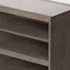 A close-up view of a wooden shelving unit with two open shelves and a smooth, light brown finish. The shelves have a clean, modern design.