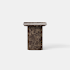 A small, modern side table made of dark brown marble with white veining. The table has a cylindrical base and a rectangular top with rounded corners, set against a plain white background.
