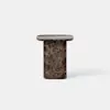 A small, modern side table made of dark brown marble with white veining. The table has a cylindrical base and a rectangular top with rounded corners, set against a plain white background.
