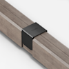 A black metal bracket labeled THUMA joins two pieces of light wood together on a white background.