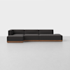 A modern, dark gray sectional sofa with a wooden base sits on a light gray floor against a plain white background. The sofa has clean lines and a low profile, with seating for several people.
