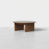A round wooden coffee table with a thick top and sturdy, rectangular legs, displayed against a plain white background.