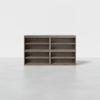 A wooden shelving unit with a gray finish, featuring two columns and three rows of open shelves, placed on a smooth, light-colored floor against a plain white background.
