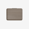 A rectangular, light brown wooden tray with rounded corners and a small black tab at the top, shown on a plain white background.