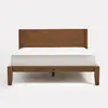 A wooden bed frame with a matching rectangular headboard, supporting a white mattress. The design is minimalist and modern, set against a plain white background.