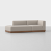 A modern beige sectional sofa with a wooden base sits on a light grey floor against a plain white background. The sofa has clean lines and an L-shaped design with a left-facing chaise lounge.
