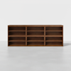 A large, rectangular wooden bookshelf with three columns and three rows of open shelves, standing on a light gray floor against a plain white background.