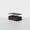 A dark wooden rectangular storage box with its lid hovering above, shown against a plain white background. The box and lid appear separated to display the inside of the box.