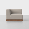 A modern, light gray upholstered corner sofa with clean lines and a wooden base, shown against a plain white background.