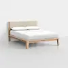 A modern wooden bed frame with an upholstered beige headboard, neatly made with white bedding and two white pillows, set against a plain white background.