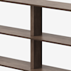 Three wooden shelves separated by thick vertical supports, photographed closely against a plain white background. The wood has a smooth, dark brown finish, and the overall design appears modern and minimalistic.
