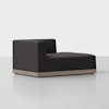 A modern black chaise lounge with a single armrest on the left side and a low-profile wooden base, set against a plain white background.