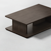 A modern, rectangular dark wood coffee table with a thick top, wide central support panel, and open lower shelf, positioned on a light-colored floor.