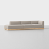 A modern, light gray sectional sofa with clean lines, low backrests, and a wooden base, placed on a smooth light gray floor against a plain white background.