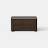 A dark brown wooden storage chest with clean lines, set against a plain white background and a light gray floor.
