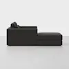 A dark gray modern sectional sofa with a chaise lounge on the right side, shown from the side against a plain white background.