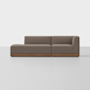 A modern, brown sectional sofa with clean lines, low wooden base, left chaise lounge, and right armrest, set against a plain white background.