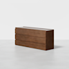 A modern wooden dresser with a rectangular shape, featuring six drawers in a 3x2 arrangement. The dresser has a smooth finish and clean, minimalist lines, set against a plain white background.