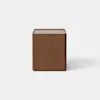 A modern wooden nightstand with a rectangular shape, featuring one open drawer and a lower closed compartment, set against a plain light gray background.