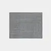 A rectangular, textured gray rug is displayed on a plain white background.