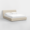 A modern beige upholstered platform bed with a low headboard, neatly made with white sheets, two pillows, and no visible decorations, set in a minimalistic white room.