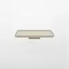 A minimalist, rectangular beige tray with raised edges is shown against a plain white background. The tray appears to be floating or suspended.
