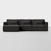 A modern, dark gray sectional sofa with three seat sections and a chaise lounge on the left side, set against a plain white background.