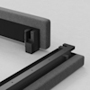 Two upholstered bed frame sections, one upright and one lying flat, with visible black metal or wooden connectors designed to fit together, shown on a light, solid surface.
