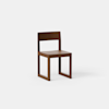 A modern wooden chair with a square seat, straight backrest, and rectangular legs, photographed against a plain white background.