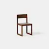 A modern wooden chair with a square seat, straight backrest, and rectangular legs, photographed against a plain white background.