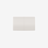 A single white rectangular light switch with a subtle vertical line dividing it into two equal sections, mounted on a plain white background.