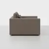 Side view of a modern, boxy, brown upholstered sofa with straight arms and two back cushions, set against a plain white background.