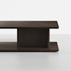 A modern, minimalist rectangular dark wood coffee table with a thick top, a central vertical support, and a matching base, set against a plain white background.