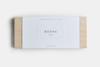A rectangular box with a white label reading BODHA Therapeutic Perfume and Smokeless Incense & Ritual Cards on a light wooden surface, labeled as a Ritual Incense Kit.
