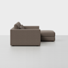 Side view of a modern brown sectional sofa with clean lines, three back cushions, and an attached chaise lounge, set against a plain white background.