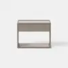 A modern, light wood nightstand with a single drawer and an open shelf below, set against a plain white background.
