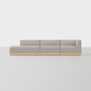 A modern, light gray sectional sofa with clean lines and wooden base, set against a plain white background. The sofa has a left chaise lounge and an armrest on the right side.