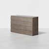 A modern, rectangular wooden dresser with a smooth light brown finish, featuring six drawers arranged in two columns against a plain white background.