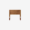 A wooden headboard with a simple, rectangular design and rounded corners, shown against a plain white background. The wood has a warm brown finish.