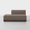 A modern, minimalist brown upholstered sectional sofa with a low backrest and left armrest, placed on a smooth light gray floor against a plain white background.