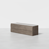 A modern, rectangular wooden dresser with a minimalist design, featuring six drawers and a smooth, light brown finish, placed in a bright, empty room with a plain white background.