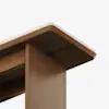 Close-up view of the corner of a wooden table with a light-colored edge detail. The image focuses on the construction and finish of the tables leg and underside against a plain white background.