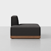 A modern armless black sofa with a wooden base, shown from the side against a plain white background.